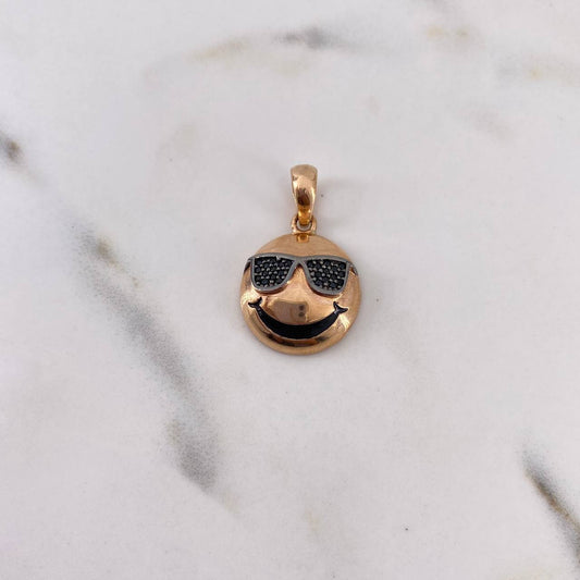 Dije Emoji Gafas 3.45gr / 2.6cm / Circones Negros Oro Rosa 18K $