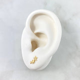 Topos Trio de Estrellas 0.75gr / Circones Blancos Oro Amarillo 18K *