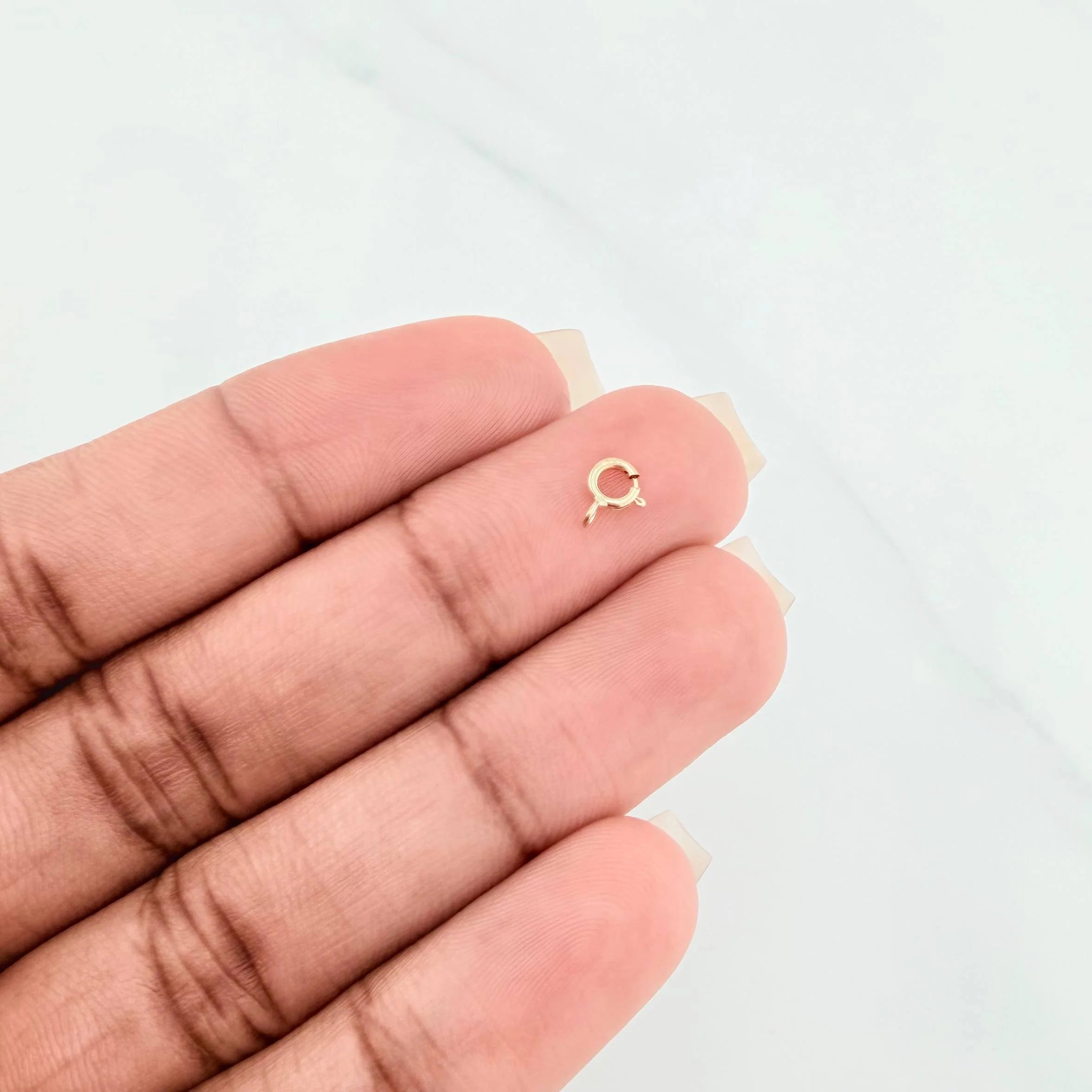 Broche Reasa 0.1 g Oro Amarillo 18K