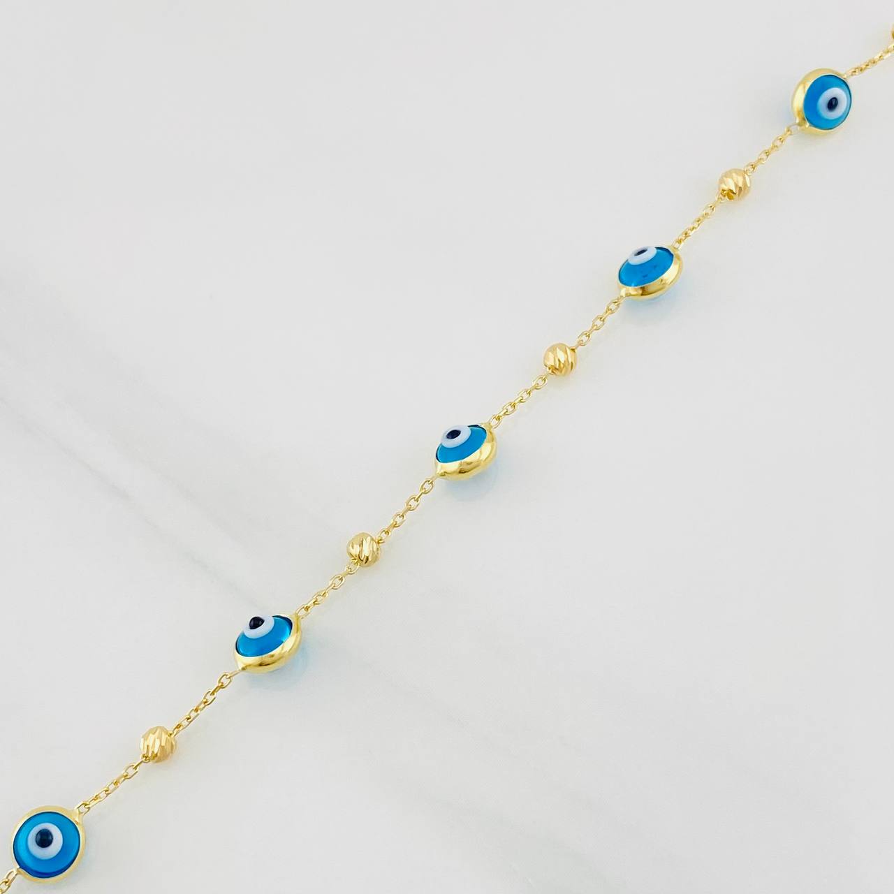 Pulso Aro Seguido Ojos Turcos 2.2g / 19.7cm / 0.85mm Oro Amarillo 18K
