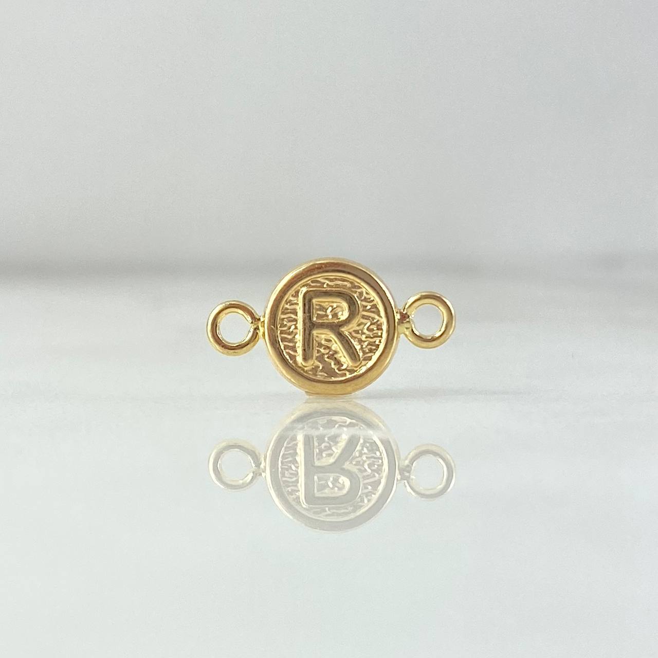 Herraje Letra R 0.4gr / 1.5cm / Circulo Texturizado Oro Amarillo