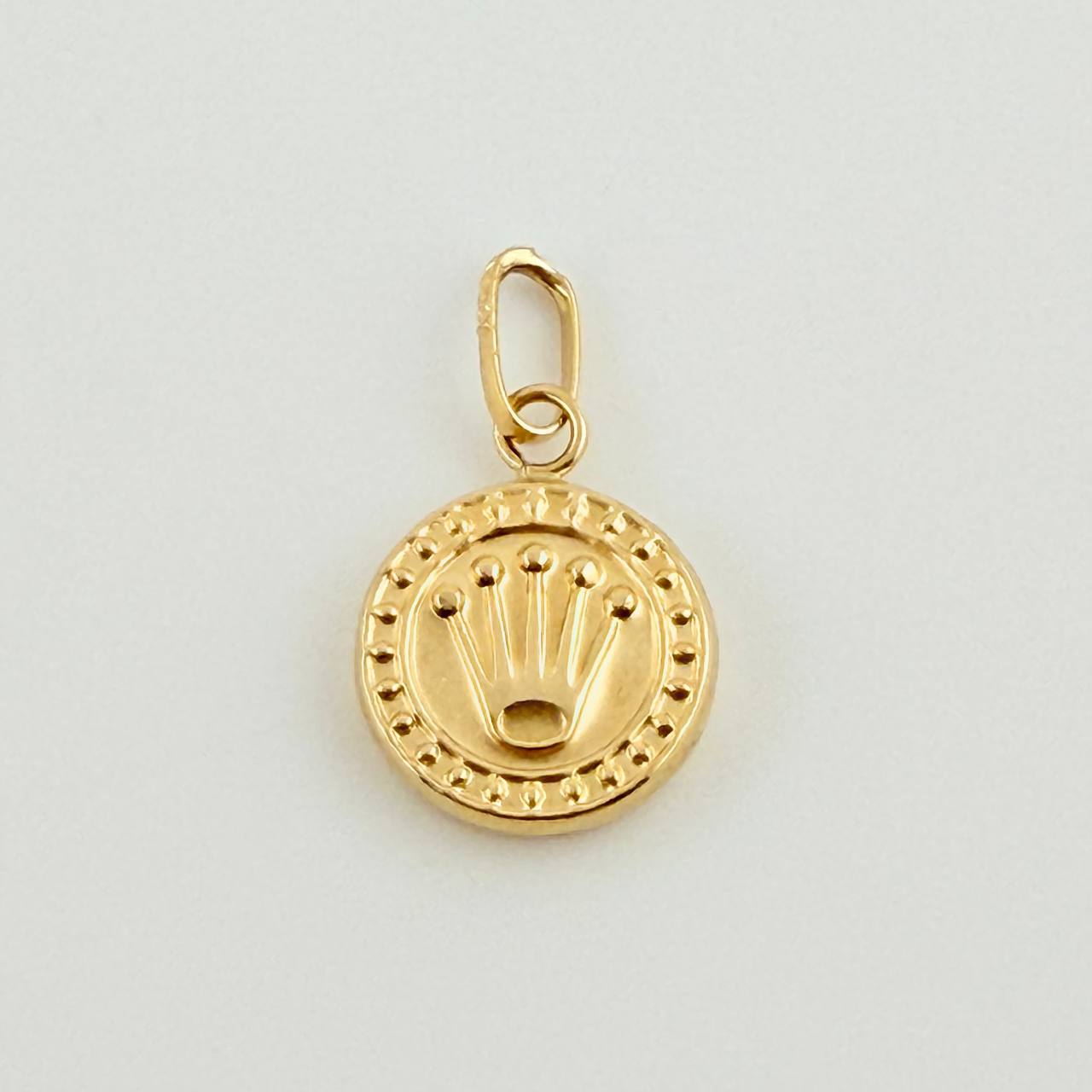 Dije Corona RX 0.5gr / 1.5cm / Oro Amarillo 18K ©
