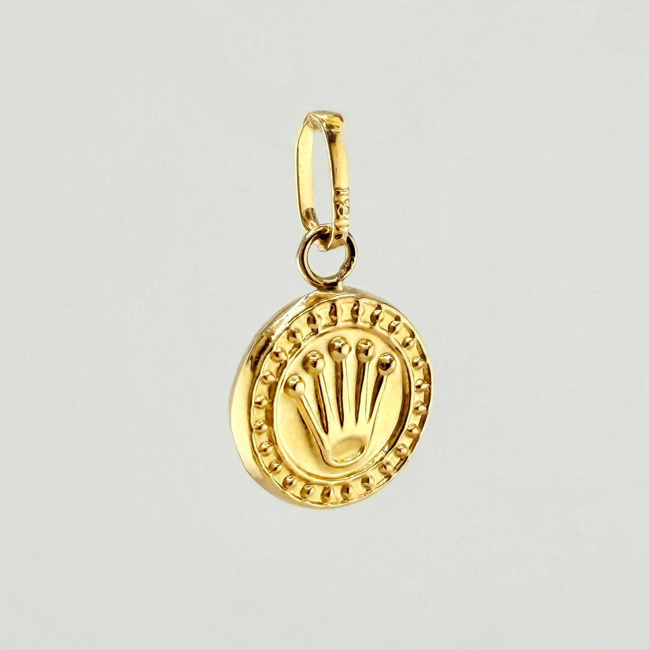 Dije Corona RX 0.55gr / 1.5cm / Oro Amarillo 18K ©