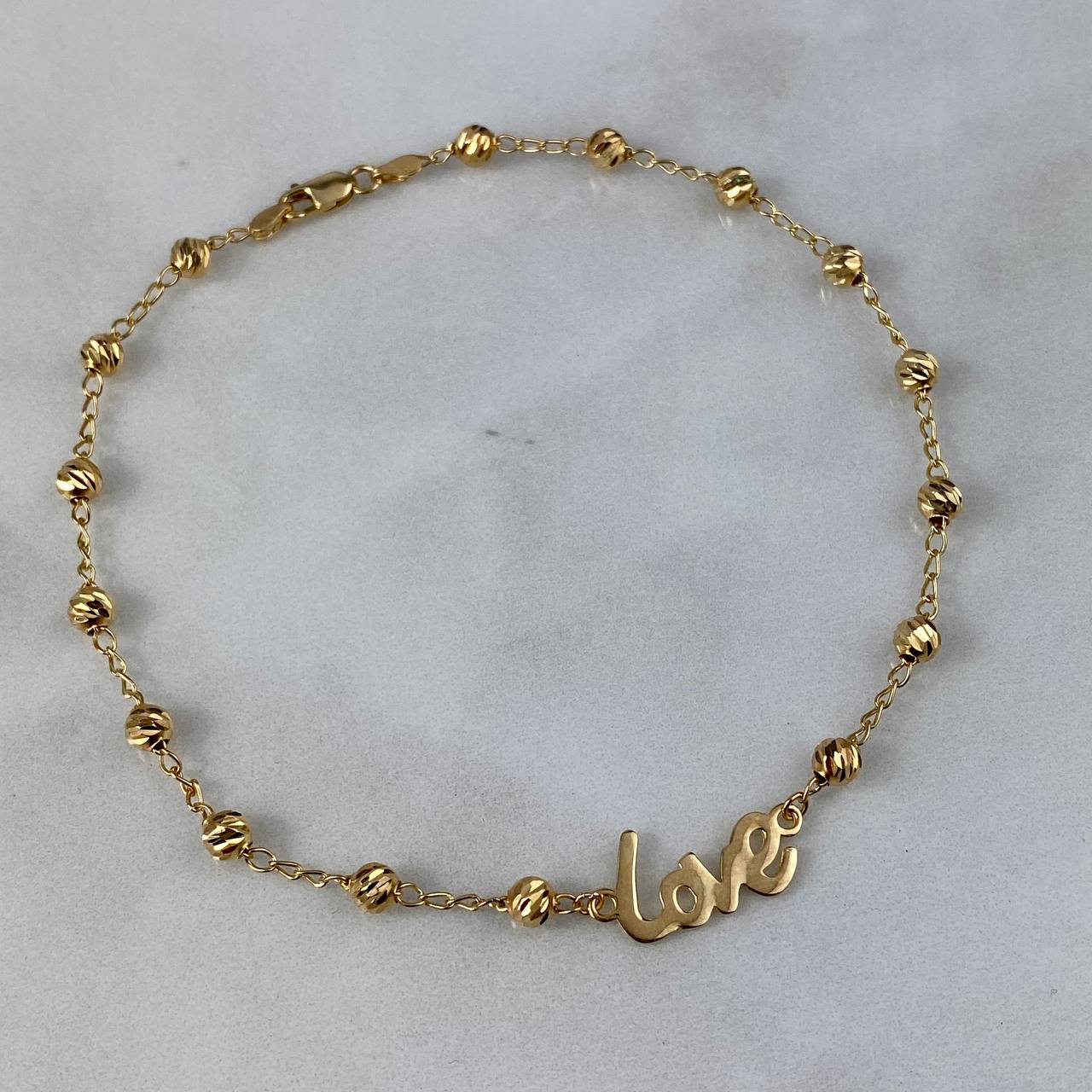 Tobillera Love 4.15gr / 25cm / 4mm Bolas Diamantadas Oro Amarillo