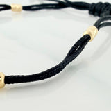 Pulsera Tejida Negra Retazo Tennis Oro Amarillo 18K