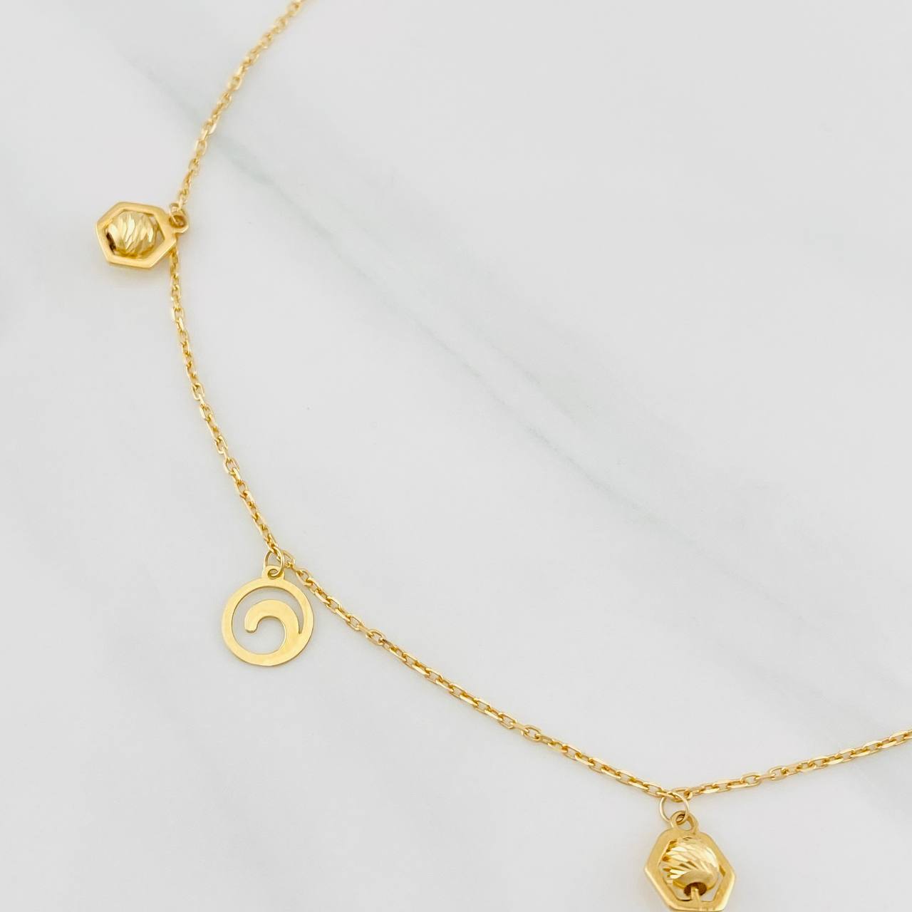 Tobillera Aro Seguido Figuras 2.45g / 24.7cm / 1.04mm Oro Amarillo 18K