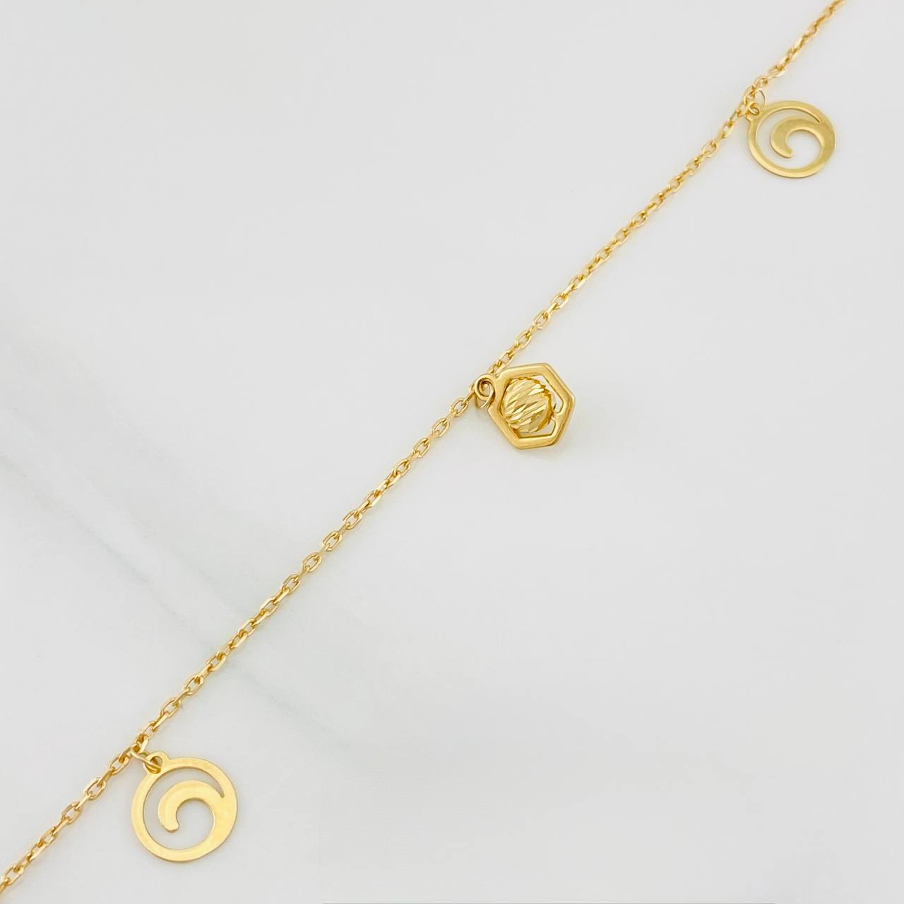 Tobillera Aro Seguido Figuras 2.45g / 24.7cm / 1.04mm Oro Amarillo 18K