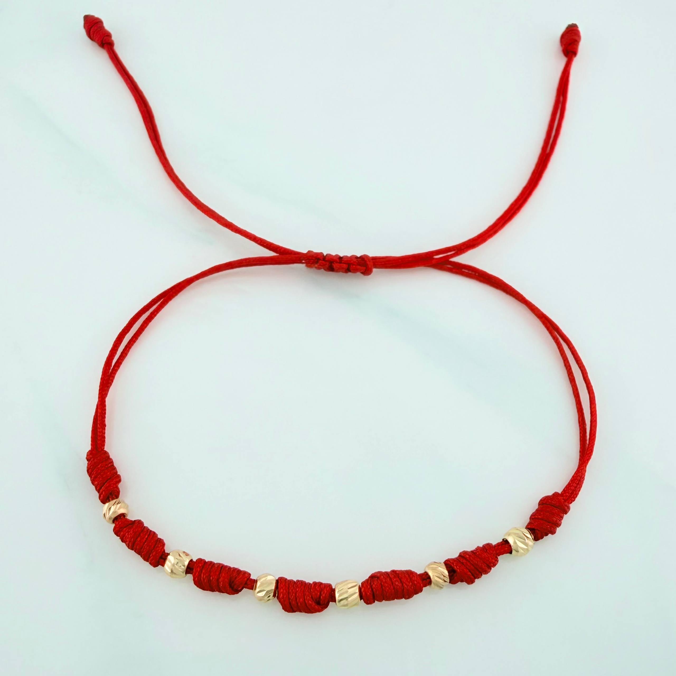 Pulsera Tejida Roja 7 Nudos 6 Bolas Diamantadas Oro Amarillo 18K