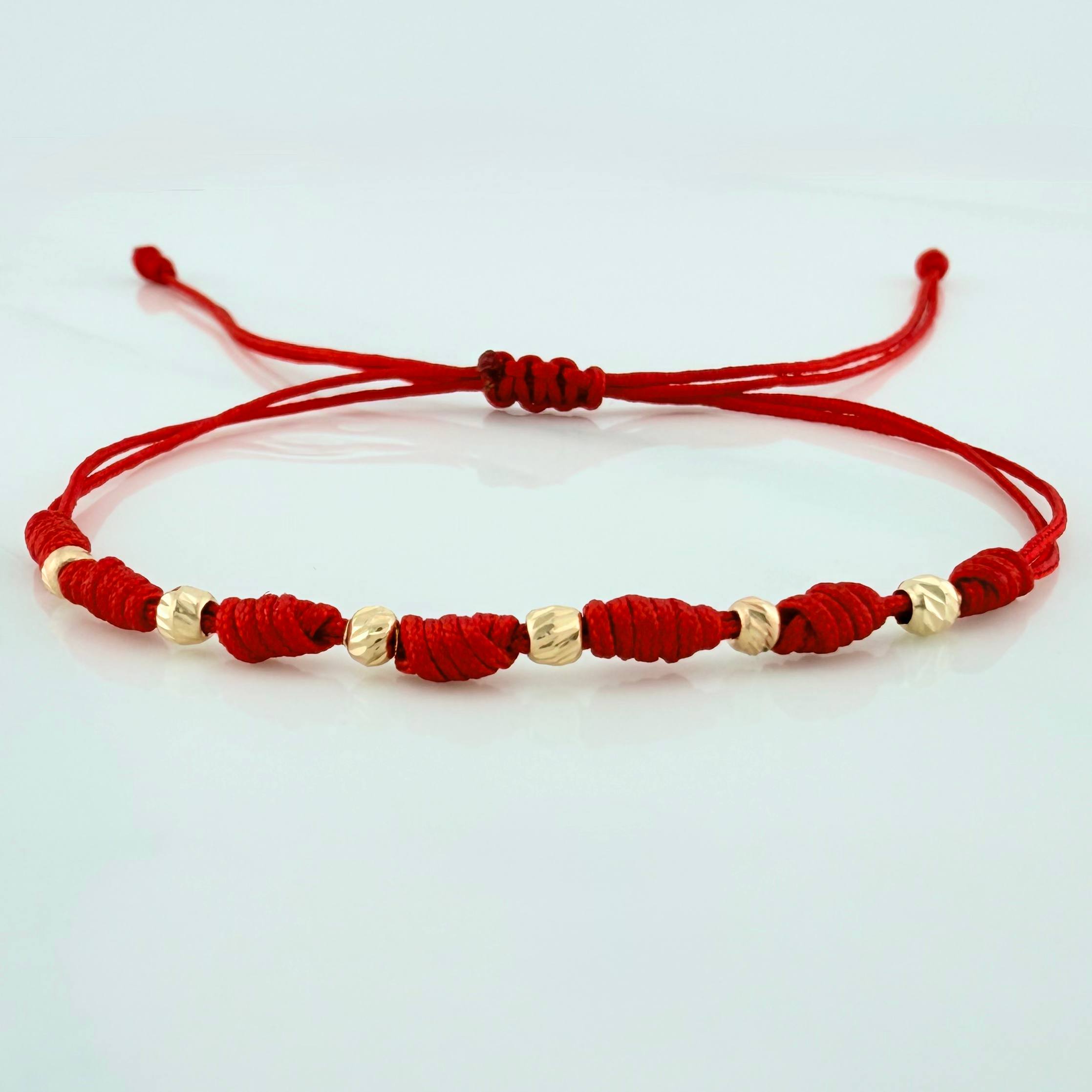Pulsera Tejida Roja 7 Nudos 6 Bolas Diamantadas Oro Amarillo 18K