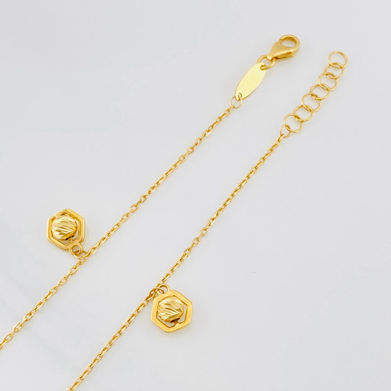 Tobillera Aro Seguido Figuras 2.45g / 23cm / 1mm Oro Amarillo 18K