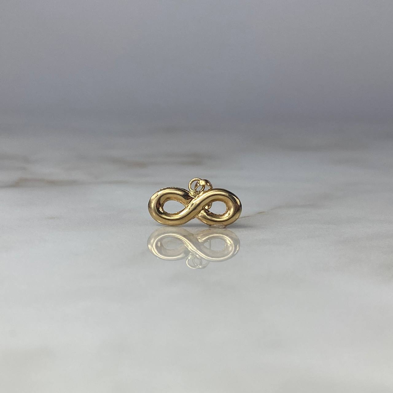 Dije Infinito 0.75gr / 1.7cm / Troquelado Oro Amarillo $