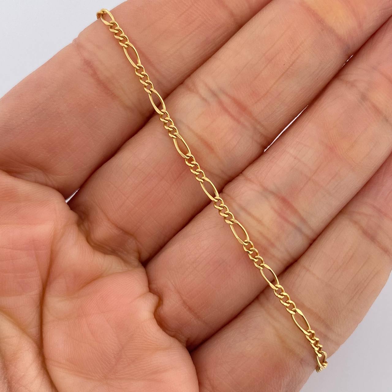 Pulso Figaro 0.9gr / 18cm / 1.8mm Oro Amarillo +1 18K $