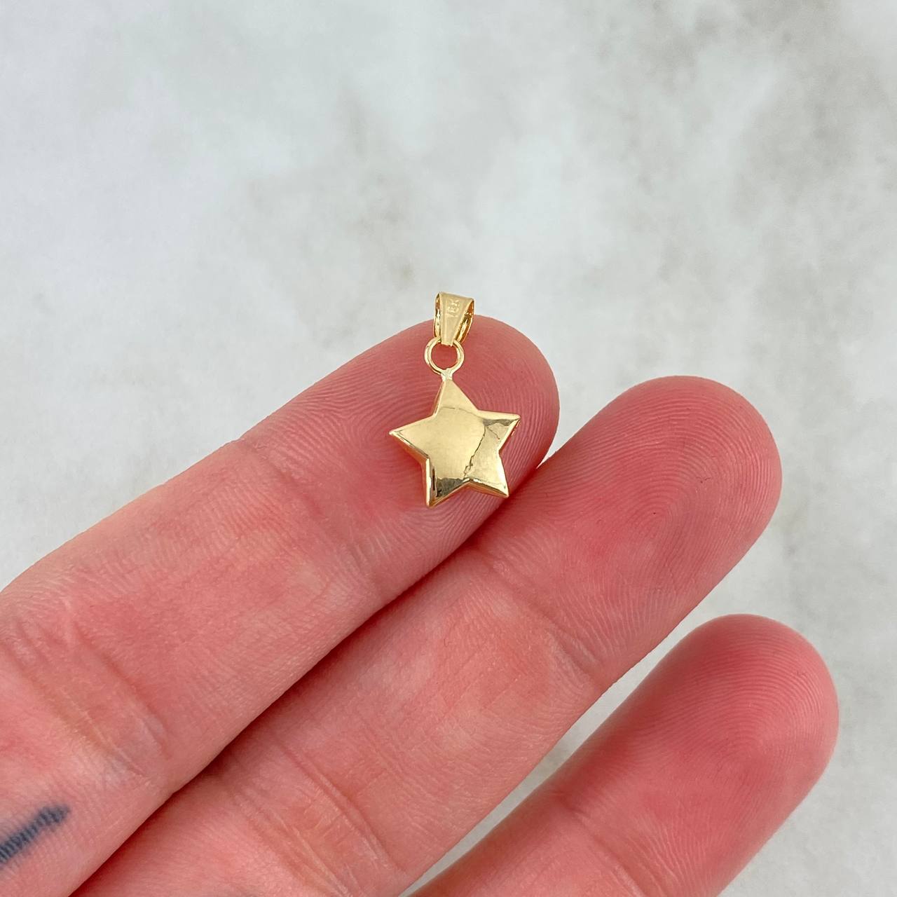 Dije Estrella 0.45gr / 1.7cm / Troquelada Oro Amarillo