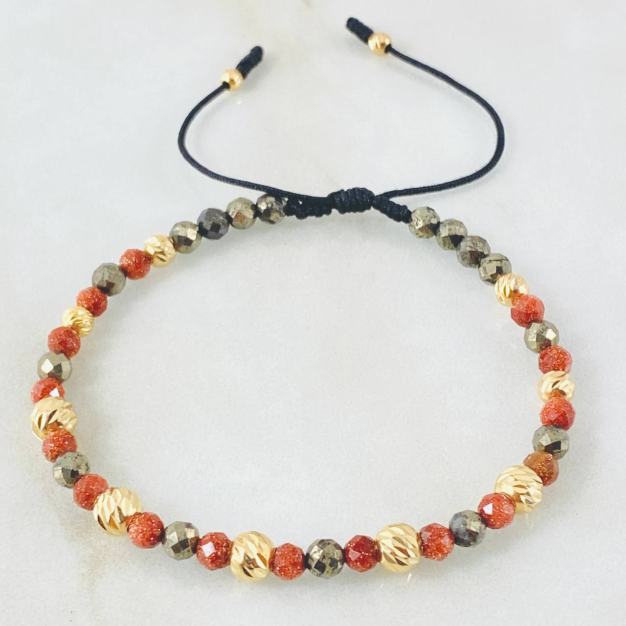 Pulsera Negra Triada Lluviosa 1.4gr / Oro Amarillo 18K  (A.C)