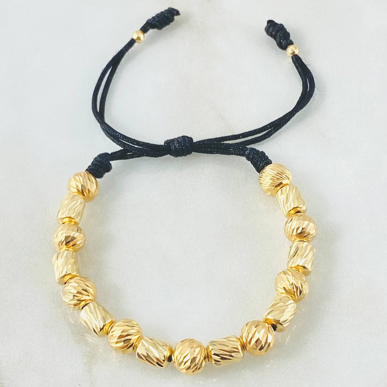 Pulsera Negra Cilindros Rayados 4.1gr / Oro Amarillo 18K *