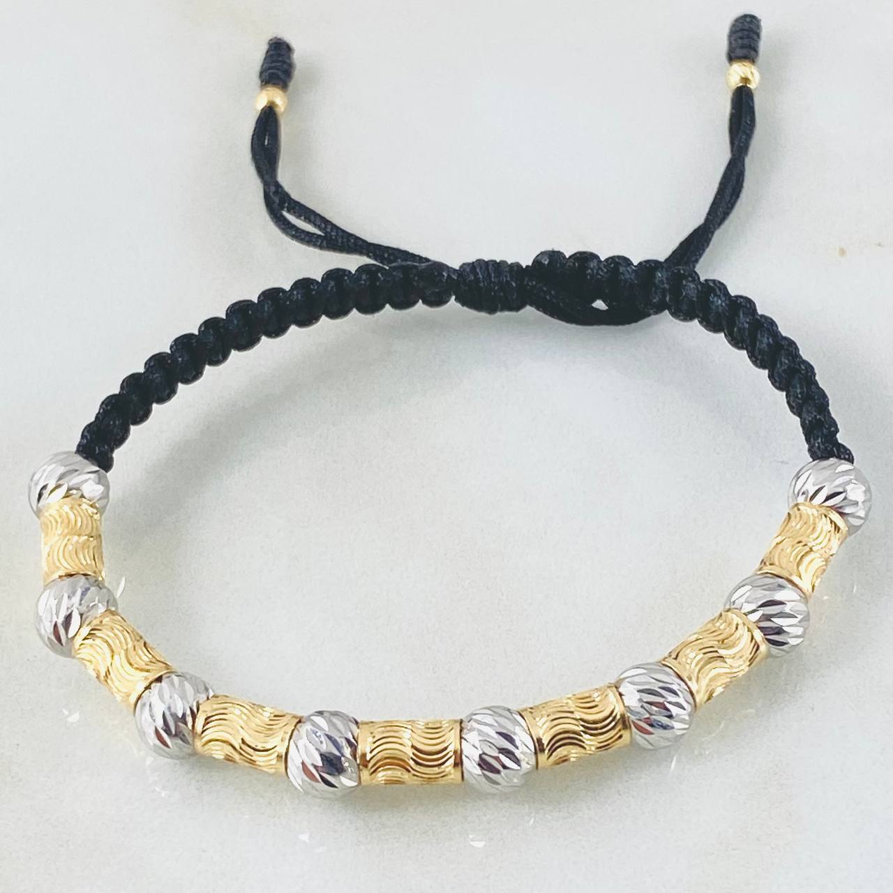 Pulsera Negra Cilindros Lunares Segmentados 2.9gr / Dos Oros Amarillo Blanco 18K *