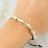 Pulsera Negra Cilindros Lunares Segmentados 2.9gr / Dos Oros Amarillo Blanco 18K *