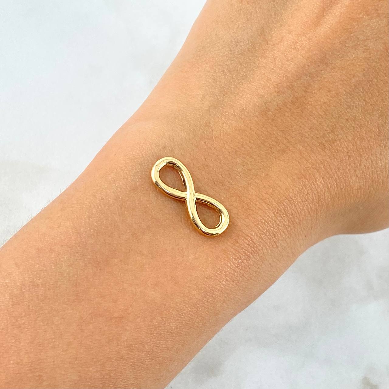 Herraje Infinito 0.8gr / 2cm / Silueta Troquelada Oro Amarillo