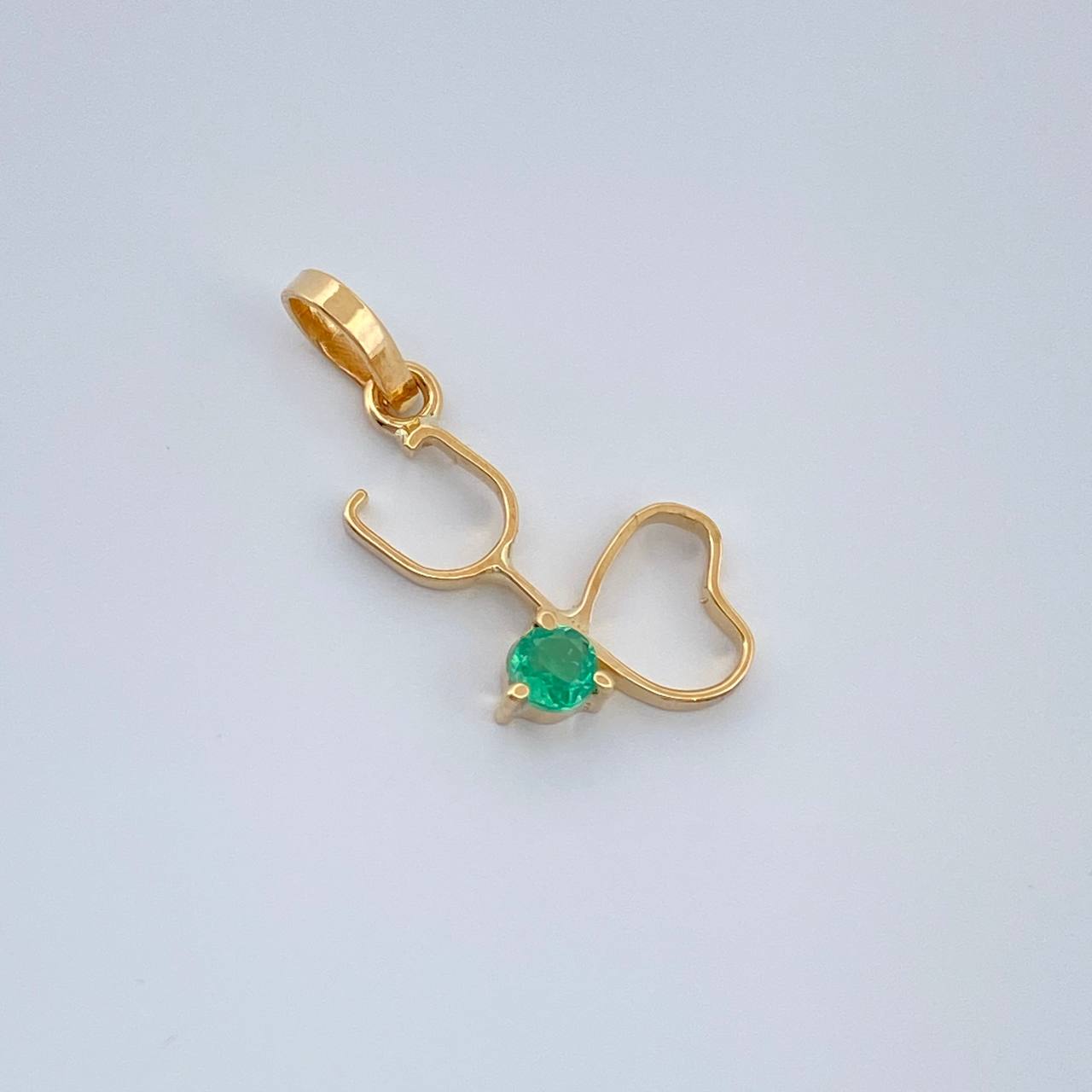 Dije Figura Fonendoscopio Esmeralda 0.4gr / 1.8cm / Oro Amarillo 18K %