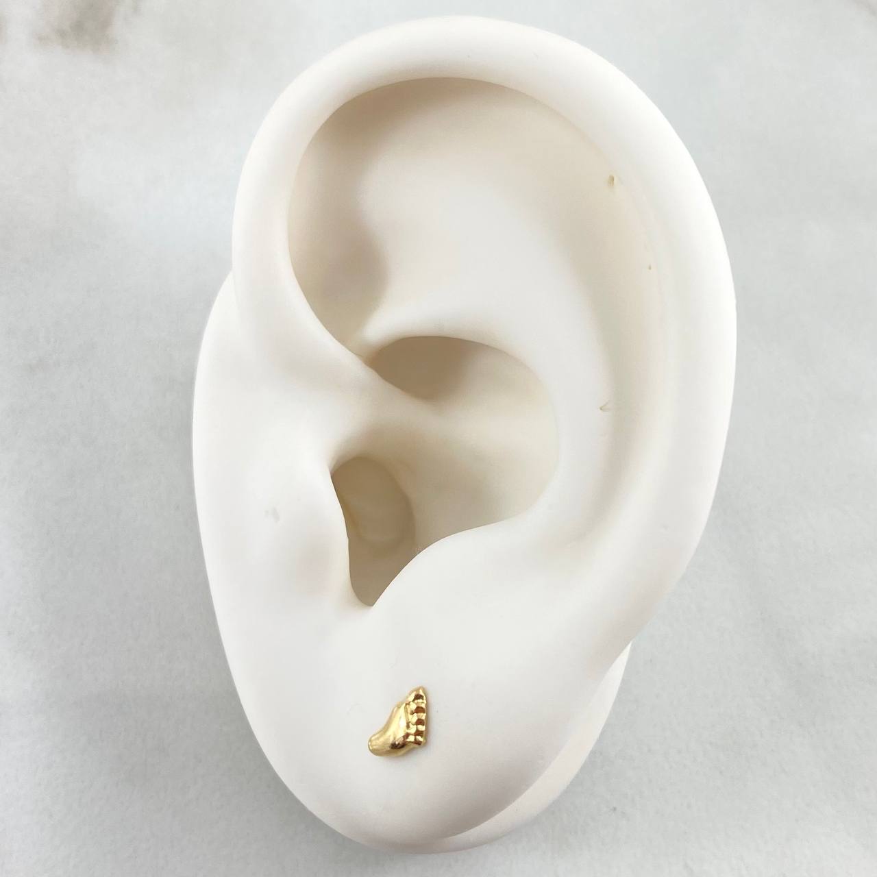 Topos Huella Pie 0.6gr / Oro 18K ©
