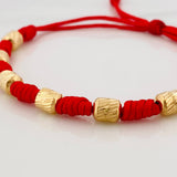 Pulsera Tejida Roja 7 Nudos 6 Cilindros Diamantados Oro Amarillo 18K