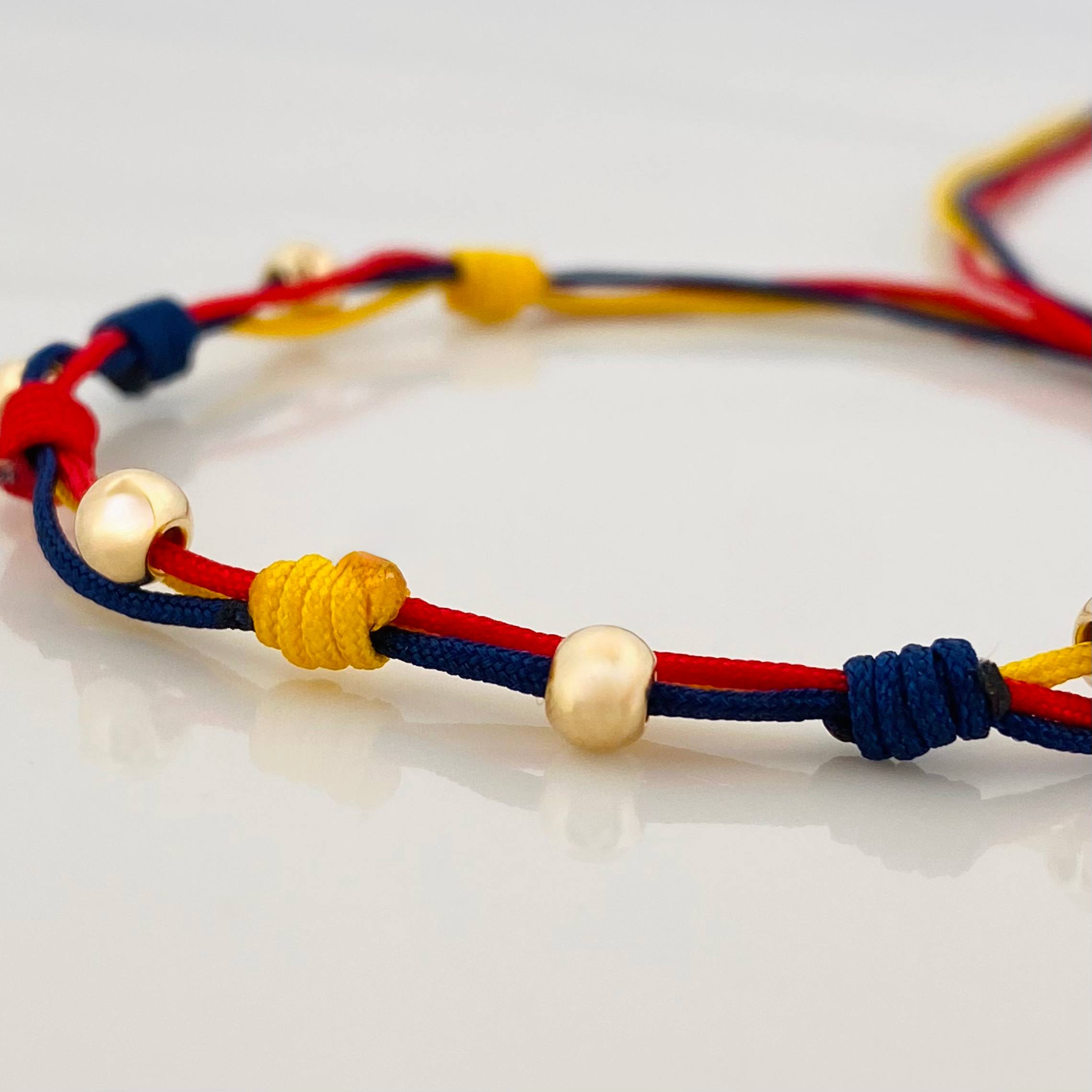 Pulsera Tejida Tricolor 5 Bolas Lisas Oro Amarillo 18K