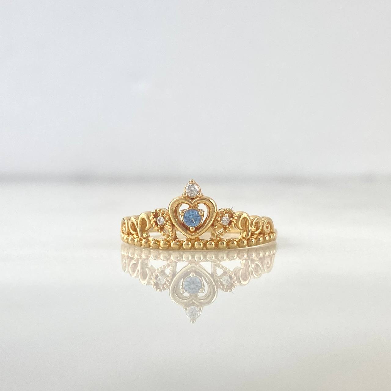 Anillo Corona 15s 2.15gr / T7 1/4 / Esferas Circon Celeste Blancos Oro Amarillo