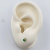 Topos Cuatro Garras Esmeralda 0.6gr / 2.67mm Oro Amarillo 18K %