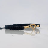 Pulsera Tejida Negra Corazon Oro Amarillo 18K