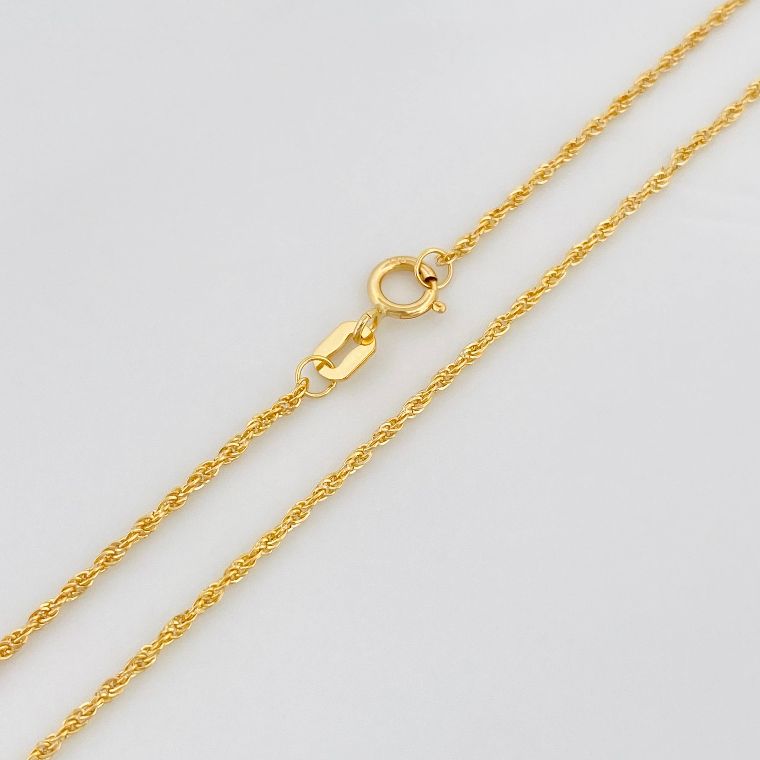 Set Cadena Lazo + Dije San Benito / 1.4 g / 50.05 cm Oro Amarillo 18K
