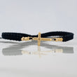 Pulsera Tejida Negra Cruz Oro Amarillo 18K