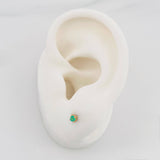 Topos Cuatro Garras Esmeralda 0.10Pts 0.55 g / 2.13 mm Oro Amarillo 18K