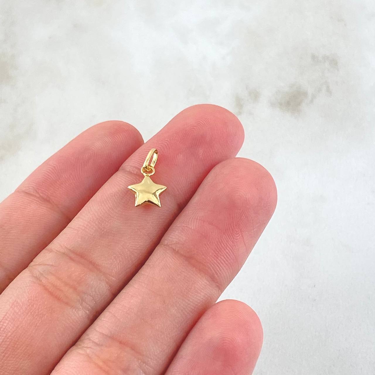 Dije Estrella 0.25gr / 1.3cm / Oro Amarillo 18K ©