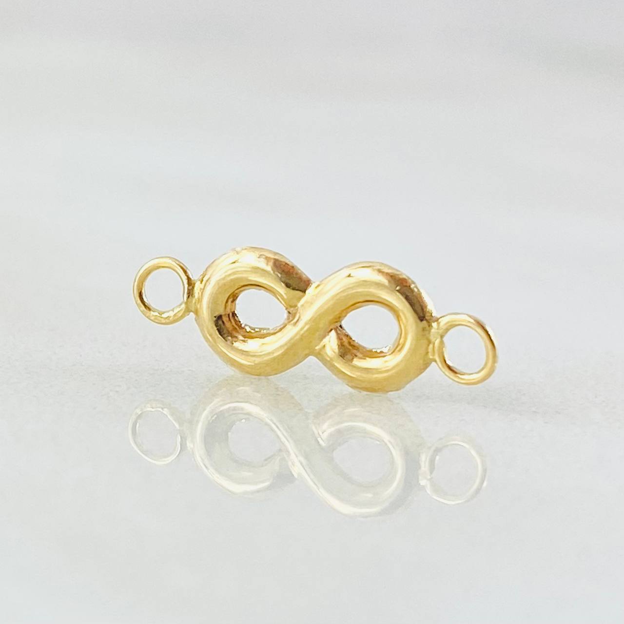 Herraje Infinito 0.4gr / 2cm / Oro Amarillo 18K ©