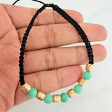Pulsera Tejida Negra Morralla Esmeralda 5 Und Oro Amarillo 18K
