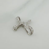 Dije Moño 2.35 g / 1.7 cm Oro Blanco 18K