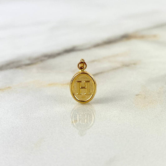 Dije Letra H Ovalada 0.6gr / 1.8cm / Troquelada Oro Amarillo