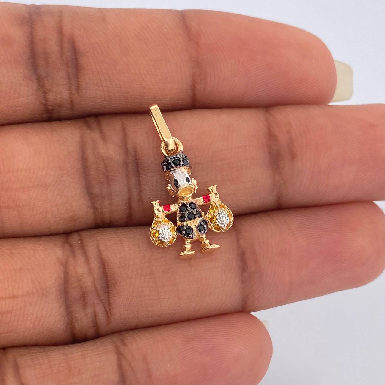 Dije Pato Bolsa de Dinero 1.55gr / 2.2cm / Tres Oros 18K $
