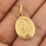Dije Maria Milagrosa 0.85gr / 2.5cm / Oro Amarillo 18K $