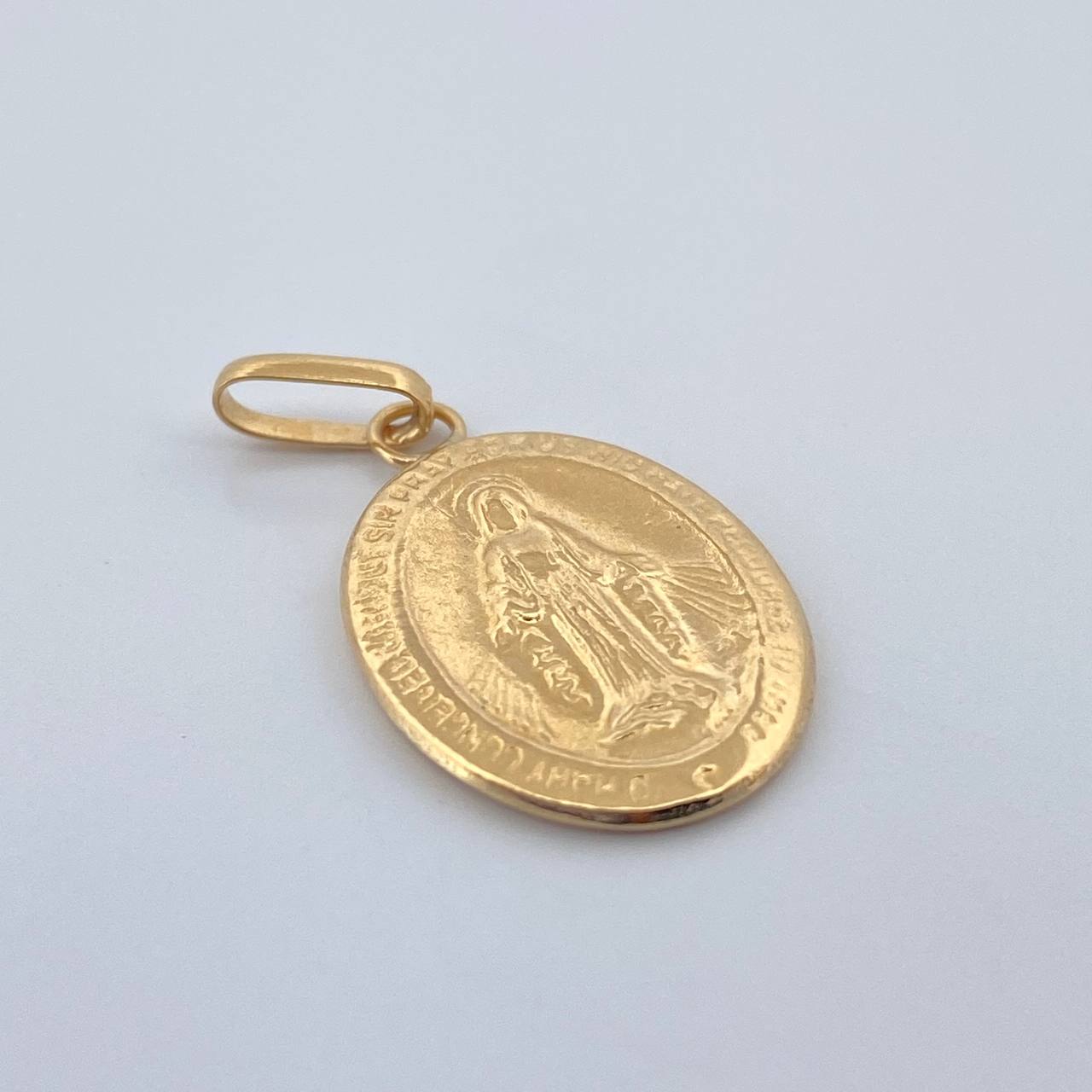 Dije Maria Milagrosa 0.85gr / 2.5cm / Oro Amarillo 18K $