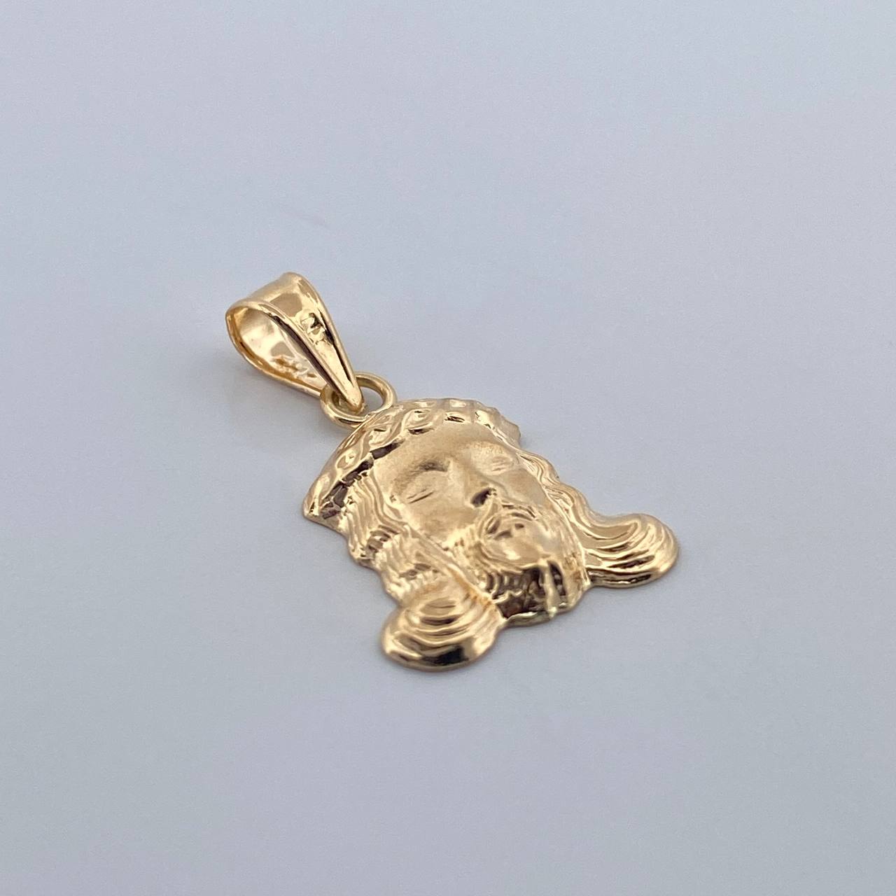 Dije Rostro Cristo 0.7gr / 2cm / Oro Amarillo 18K $