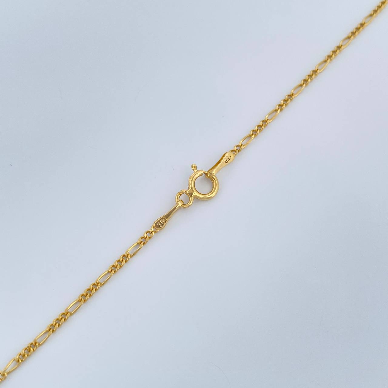 Cadena Figaro 1.45gr / 50.7cm / 1.32mm Oro Amarillo +1 18K $