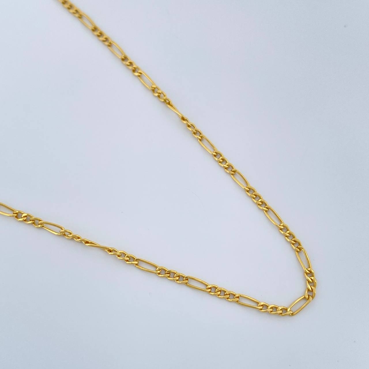 Cadena Figaro 1.4gr / 50.3cm / 1.35mm Oro Amarillo +1 18K $