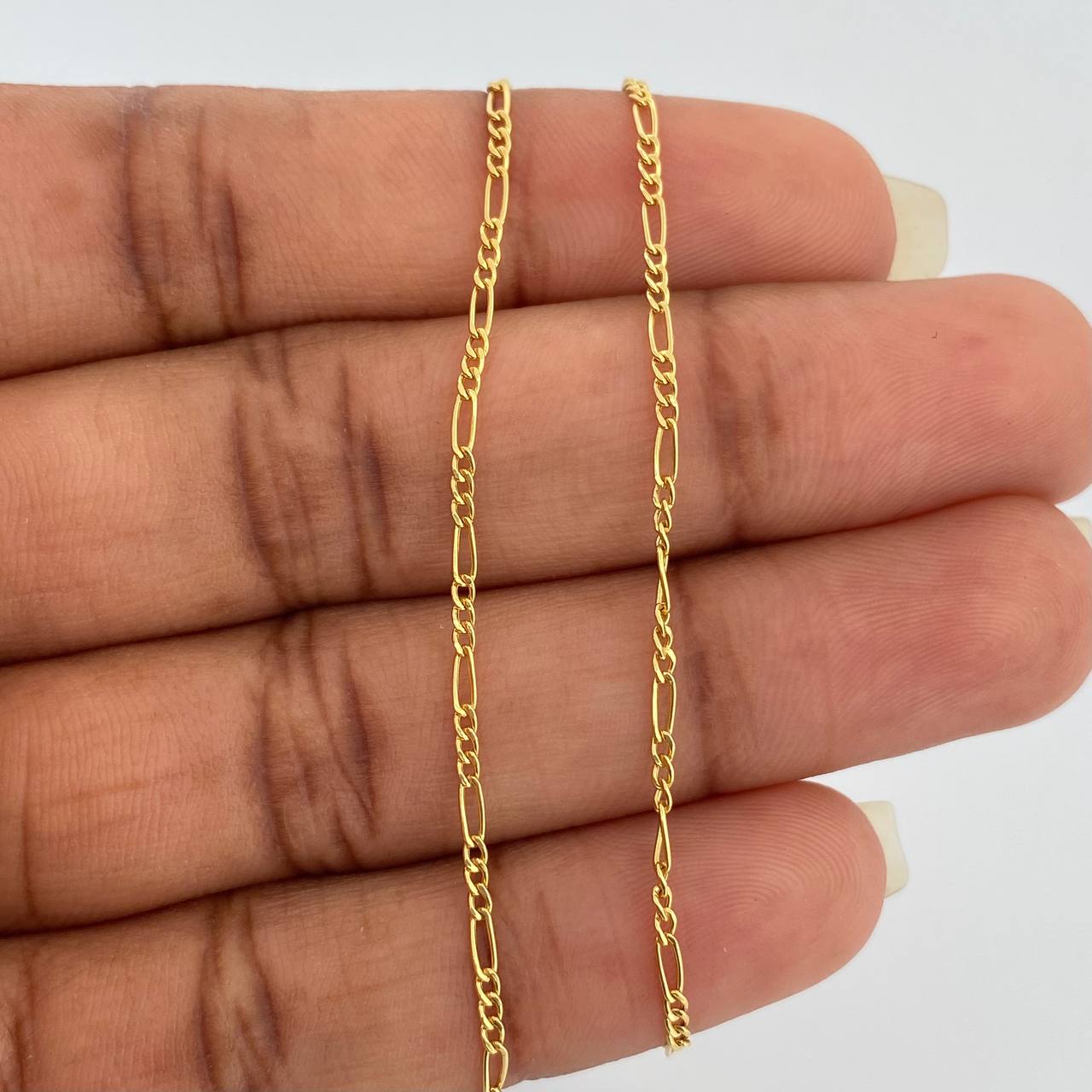 Cadena Figaro 1.4gr / 50.3cm / 1.35mm Oro Amarillo +1 18K $