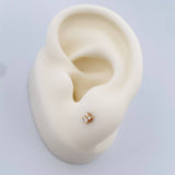 Topos Flor Diamante 0.65gr / Oro Amarillo 18K &