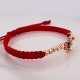 Pulsera Tejida Roja Pato Bolsas de Dinero Tres Oros 18K