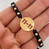 Pulsera Tejida Negra Placa 11-11 Oro Amarillo 18K