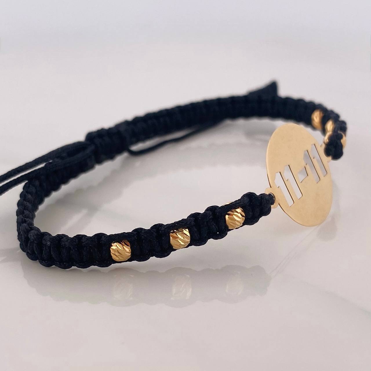 Pulsera Tejida Negra Placa 11-11 Oro Amarillo 18K