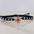 Pulsera Tejida Negra Pato Bolsas de Dinero Tres Oros 18K