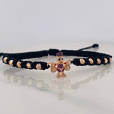 Pulsera Tejida Negra Pato Bolsas de Dinero Tres Oros 18K